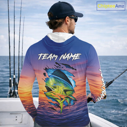 Angler wearing Mahi Mahi Fishing Sunset custom long sleeve hooded mahi mahi offshore fishing shirt on the boat at sunset