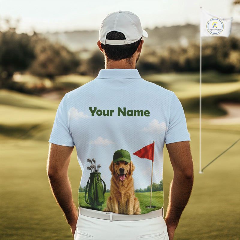 Man wearing a light blue polo shirt with a dog and golf club design on a golf course
