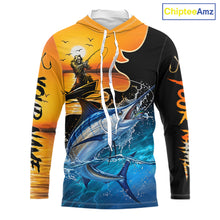Load image into Gallery viewer, Long sleeve hooded fishing shirt with a fish reaper and marlin design on a sunset background