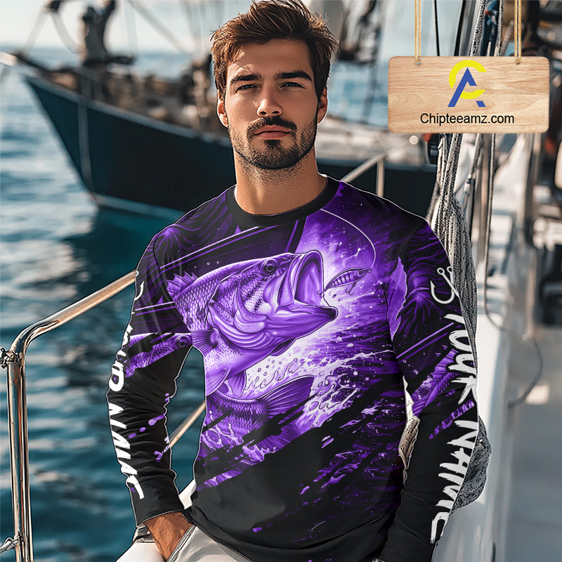 Man wearing a long sleeve fishing shirt with a purple bass fish design on a boat