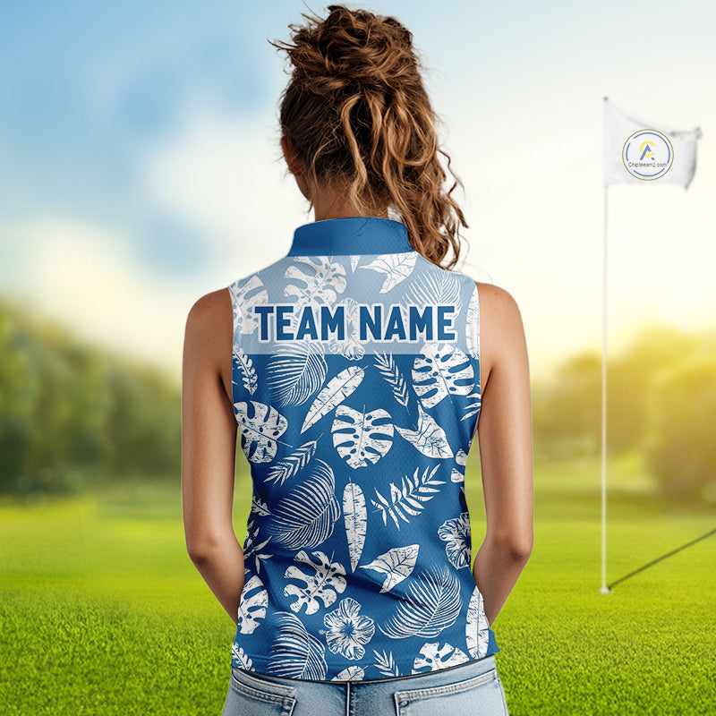 Woman wearing a blue sleeveless golf shirt with white leaf pattern on a golf course