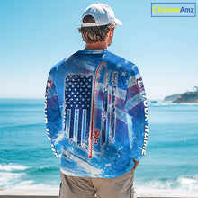 Load image into Gallery viewer, Man on a boat wearing a blue American flag largemouth bass hooded fishing shirt with custom name on the sleeves