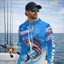 Load image into Gallery viewer, Man wearing a blue patriotic marlin fishing shirt with custom name, standing on a boat
