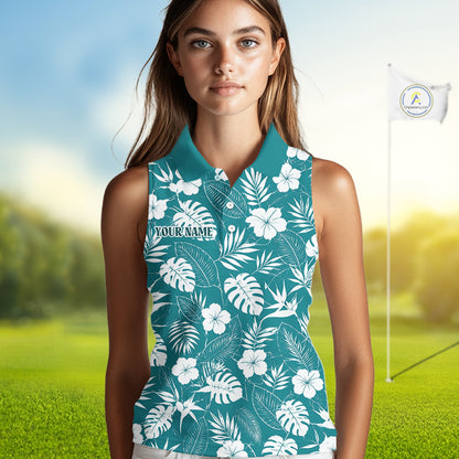 Woman wearing a teal sleeveless shirt with white floral pattern on a golf course