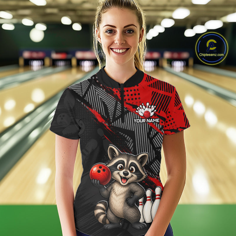 Woman bowler wearing custom red funny raccoon bowling team 1/4 quarter zip shirt on the lanes