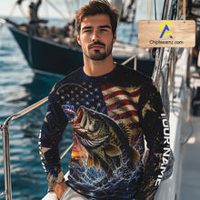 Load image into Gallery viewer, Man on a boat wearing a American flag bass fishing shirt long sleeve, sitting on the boat