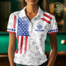 Load image into Gallery viewer, Woman wearing a white American flag 8 ball billiard jersey beside a pool table front view.