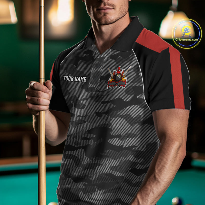 Man wearing a red camouflage American flag 8 ball billiard jersey beside a pool table front view.