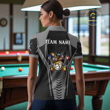 Load image into Gallery viewer, Back view of woman wearing a grey 9 ball cowboy pool shirt in a billiards hall.