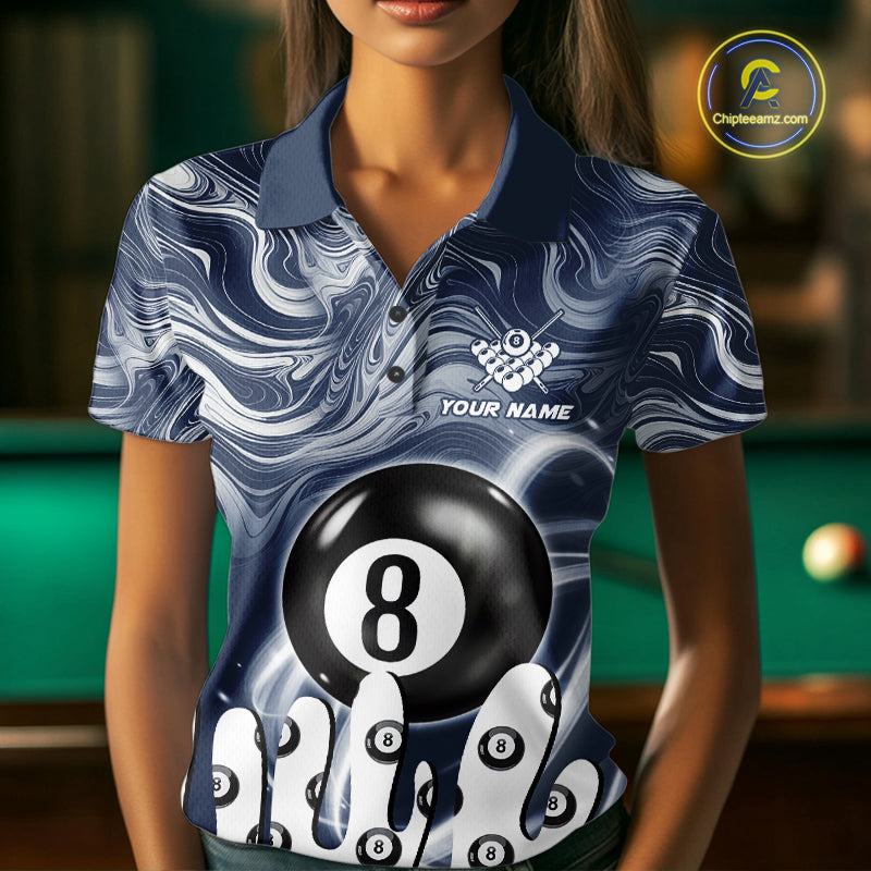 Woman wearing a blue marble swirl 8 ball billiard jersey beside a pool table front view.