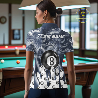 Back view of woman wearing a blue marble swirl 8 ball pool shirt in a billiards hall.