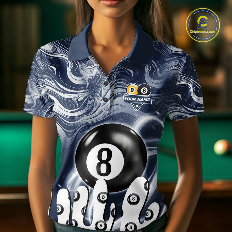 Woman wearing a blue marble swirl 8 ball and 9 ball billiard jersey beside a pool table front view.