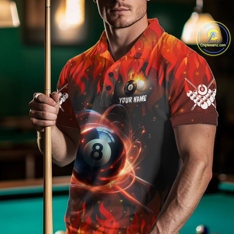 Man wearing a red 8 ball fire flame billiard jersey beside a pool table front view.