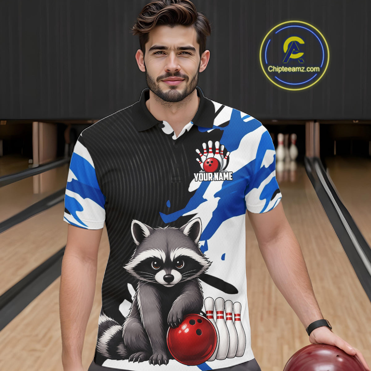 Man wearing a custom bowling shirt with a raccoon design in a bowling alley.