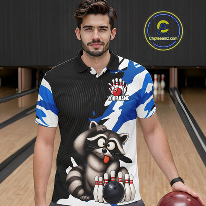 Man wearing a bowling-themed shirt with a raccoon design in a bowling alley.