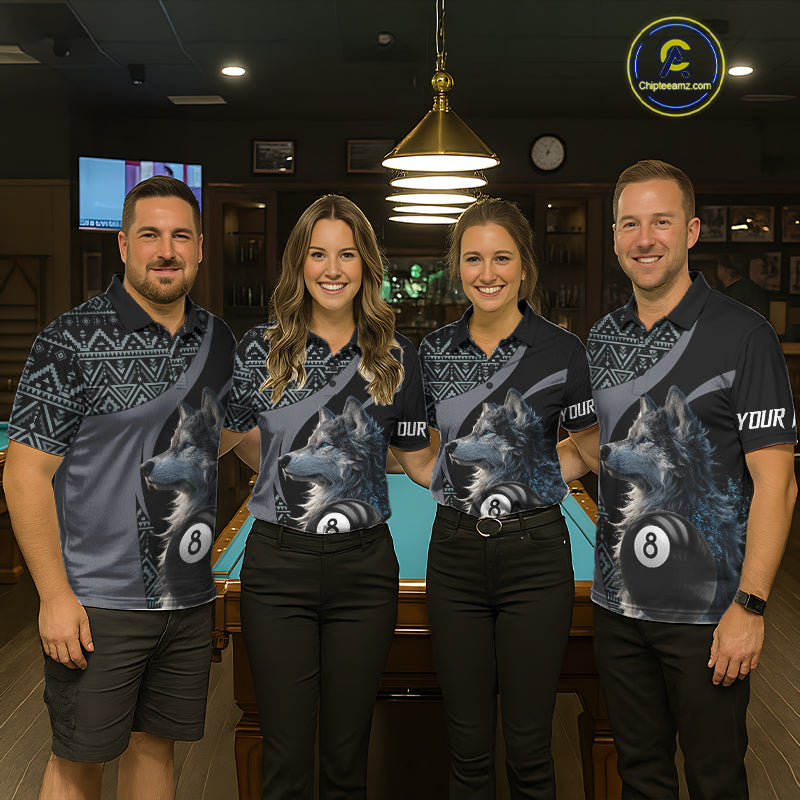 Four people wearing matching shirts with a wolf and 8 ball pool design in a bar setting.