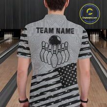 Load image into Gallery viewer, Back view of man wearing a grey American flag bowling polo shirt inside a bowling alley.