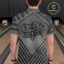 Load image into Gallery viewer, Back view of man wearing a grey American flag bowling polo shirt inside a bowling alley.