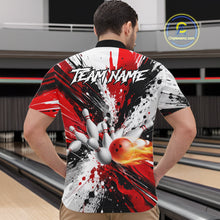 Load image into Gallery viewer, Back view of man wearing a red splatter bowling quarter zip shirt in a bowling alley.