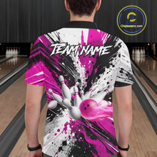 Load image into Gallery viewer, Back view of man wearing a pink splatter bowling polo shirt inside a bowling alley.