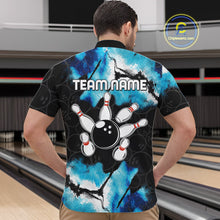 Load image into Gallery viewer, Back view of man wearing a dreamy blue bowling quarter zip shirt in a bowling alley.