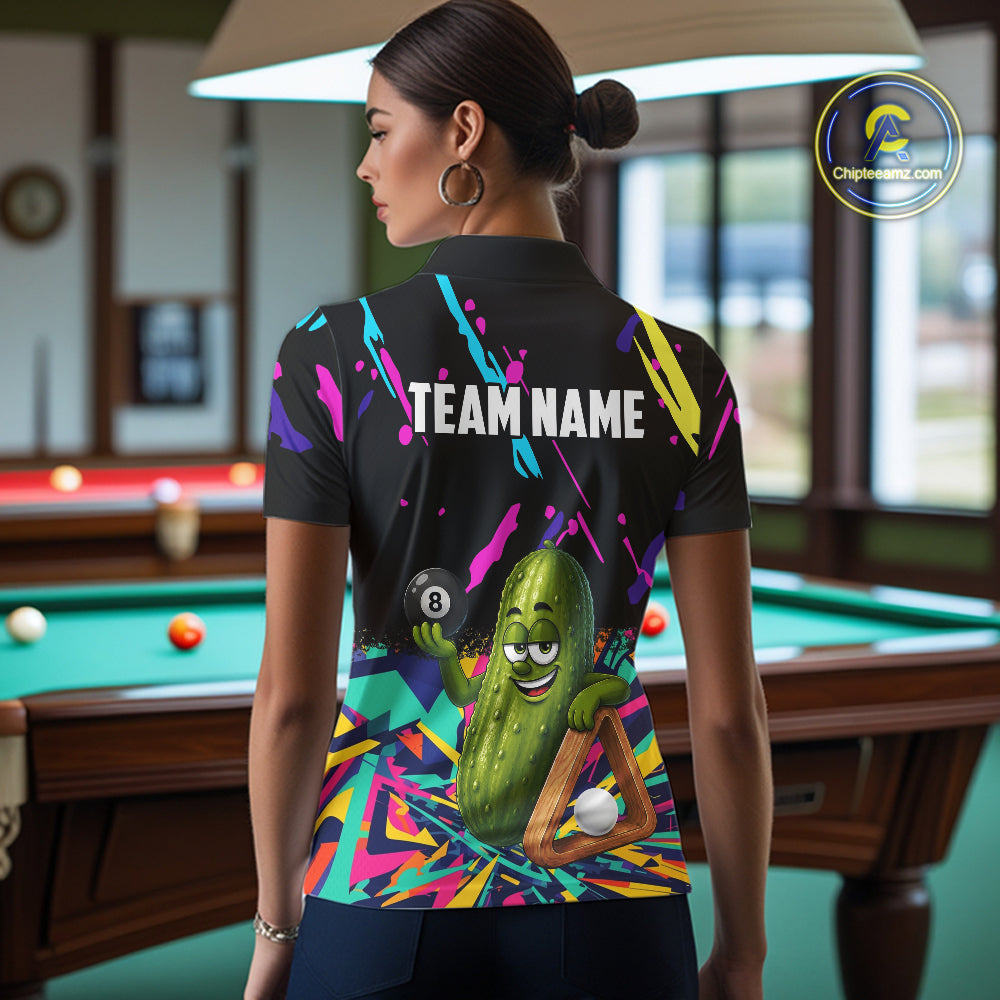 Back view of woman wearing a colorful pickle 8 ball pool shirt in a billiards hall.