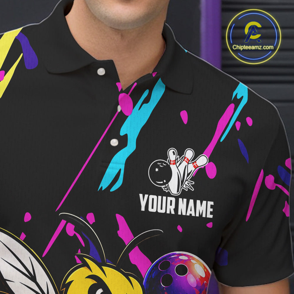 Black bowling polo shirt with colorful designs and a bee graphic, featuring 'Your Name' text, on a dark background.