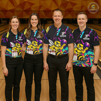 Four people wearing matching bowling-themed shirts with bee graphic in a bowling alley.