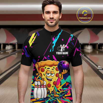 Man wearing a colorful bowling shirt with a pizza graphic in a bowling alley.