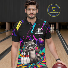 Load image into Gallery viewer, Man wearing a colorful bowling-themed shirt with a raccoon graphic in a bowling alley.