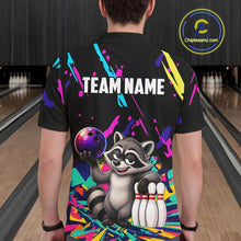 Load image into Gallery viewer, Person wearing a black bowling shirt with colorful design and raccoon graphic in a bowling alley.