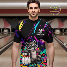 Load image into Gallery viewer, Man wearing a colorful bowling shirt with a raccoon graphic in a bowling alley.