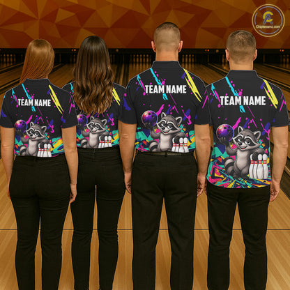 Four people wearing matching shirts with a raccoon graphic and 'TEAM NAME' text on a bowling alley background.