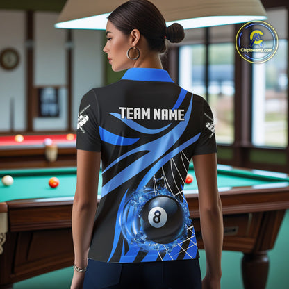 Back view of woman wearing a blue flame pool team shirt in a billiards hall.
