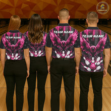 Load image into Gallery viewer, Back view of bowling team wearing matching pink lightning eagle bowling jerseys in a bowling alley.