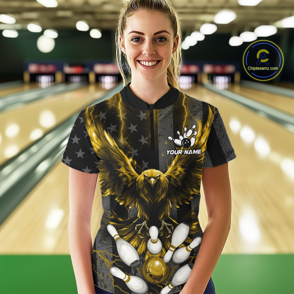 Front view of woman wearing a yellow lightning eagle bowling polo shirt in a bowling alley.