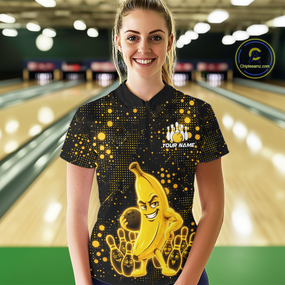 Woman wearing black and yellow funny banana bowling team jersey quarter zip shirt featuring funny banana artwork, front view.