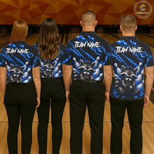 Load image into Gallery viewer, Back view of bowling team wearing matching blue neon raccoon bowling shirts in a bowling alley.