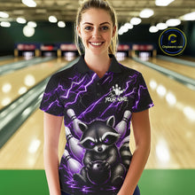 Load image into Gallery viewer, Woman wearing a purple neon lightning raccoon bowling polo shirt at a bowling alley front view.