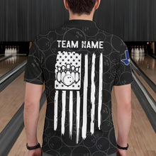 Load image into Gallery viewer, Back view of man wearing a US flag Texas bowling polo shirt inside a bowling alley.