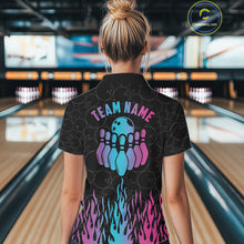 Load image into Gallery viewer, Back view of woman wearing a fire flame neon bowling polo shirt inside a bowling alley.