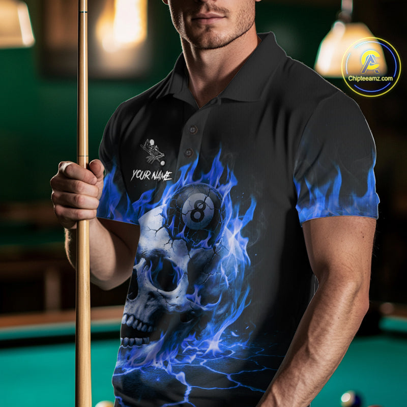 Man wearing a blue flaming skull 8 ball and 9 ball billiard jersey beside a pool table front view.