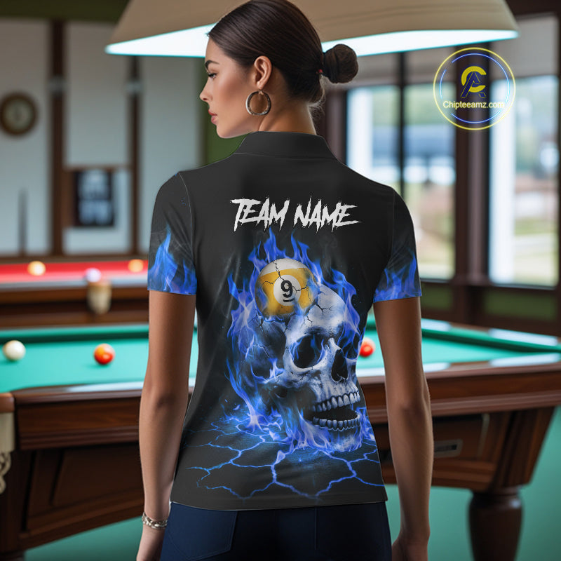 Back view of woman wearing a blue flaming skull pool shirt in a billiards hall.