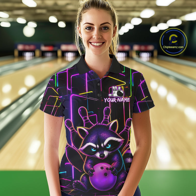 Woman wearing a funny purple neon raccoon bowling polo shirt at a bowling alley front view.