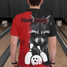 Load image into Gallery viewer, Back view of man wearing a black and red raccoon bowling polo shirt inside a bowling alley.