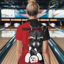 Load image into Gallery viewer, Back view of woman wearing a black and red raccoon bowling polo shirt inside a bowling alley.
