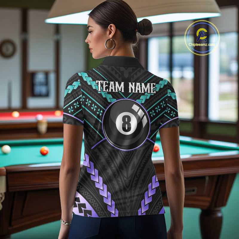 Woman wearing a teal and purple 8 ball tribal billiard jersey beside a pool table front view.