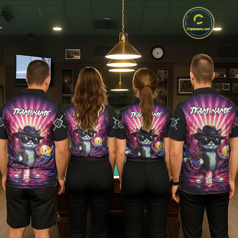 Back view of pool players wearing matching pink graffiti cat billiard shirts in a game room.