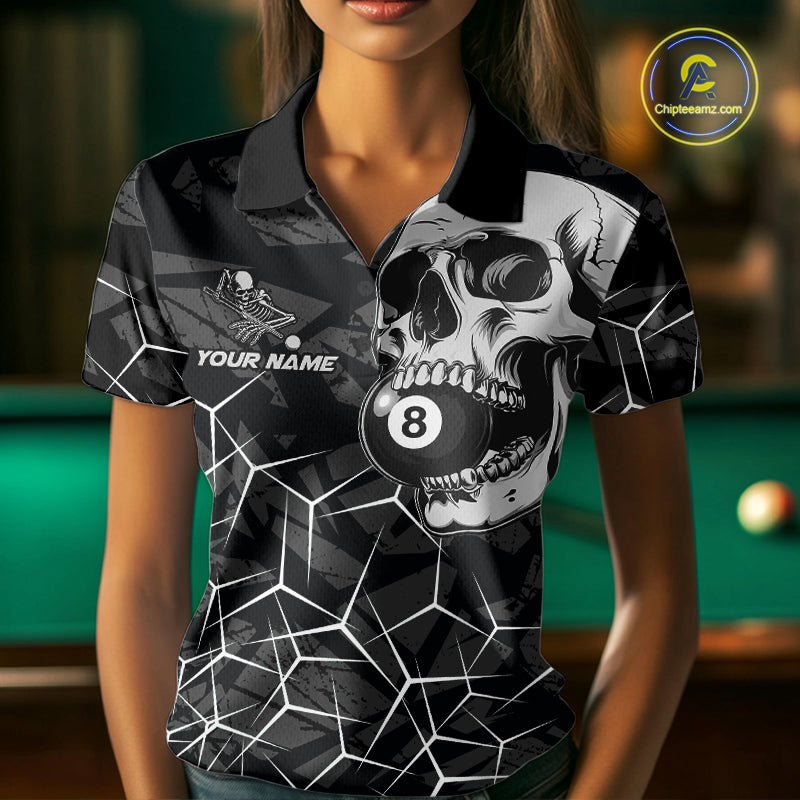 Woman wearing a black and white skull billiard jersey beside a pool table front view.