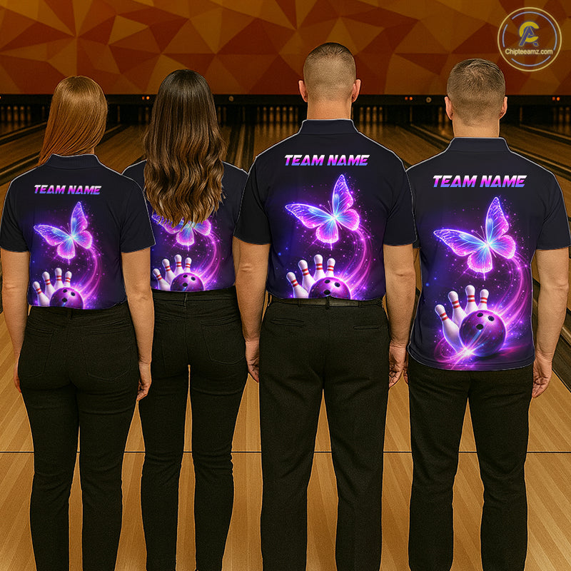 Four people wearing matching shirts with a butterfly design on a bowling alley.